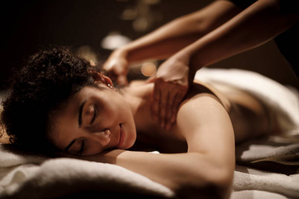 istock Young woman enjoying massage 1158070180