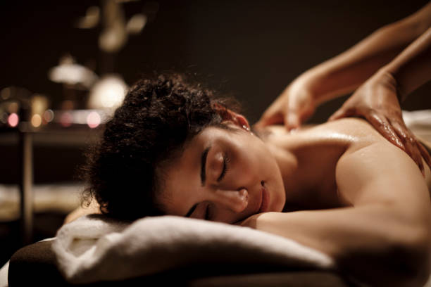 istock Young woman enjoying massage 1158070237