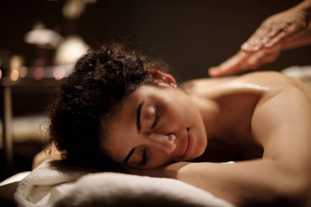 istock Young woman enjoying massage 1158070238