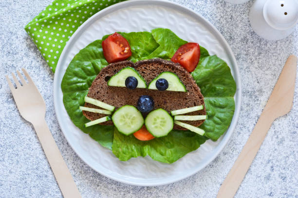 Sandwiches for children for breakfast. Animal muzzles. View from above.