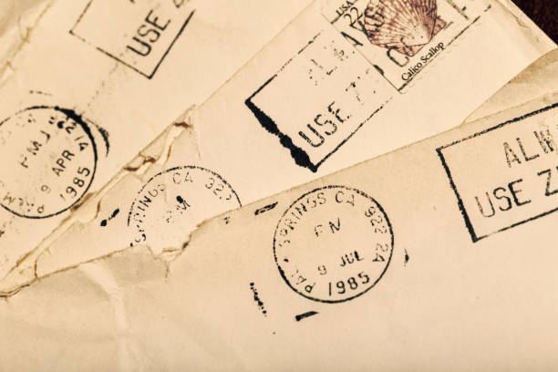 istock Old Letters in Envelopes with Postmark and Cancelled Postage Stamp 1158070254
