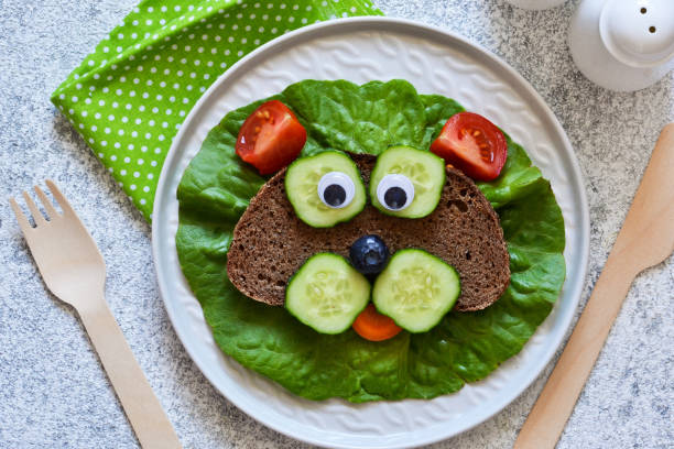 istock Sandwiches for children for breakfast. Animal muzzles. View from above. 1158070264