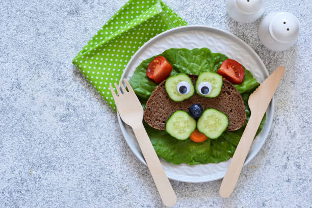 istock Sandwiches for children for breakfast. Animal muzzles. View from above. 1158070265