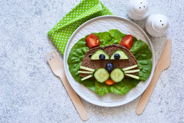 istock Sandwiches for children for breakfast. Animal muzzles. View from above. 1158070272