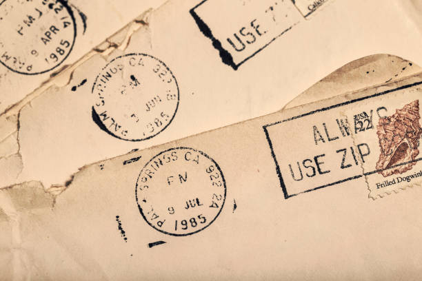 istock Old Letters in Envelopes with Postmark and Cancelled Postage Stamp 1158070276