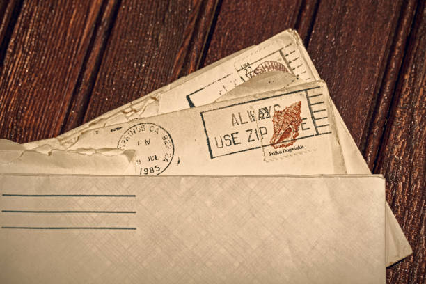 istock Old Letters in Envelopes with Postmark and Cancelled Postage Stamp 1158070336