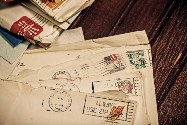 istock Old Letters in Envelopes with Postmark and Cancelled Postage Stamp 1158070432