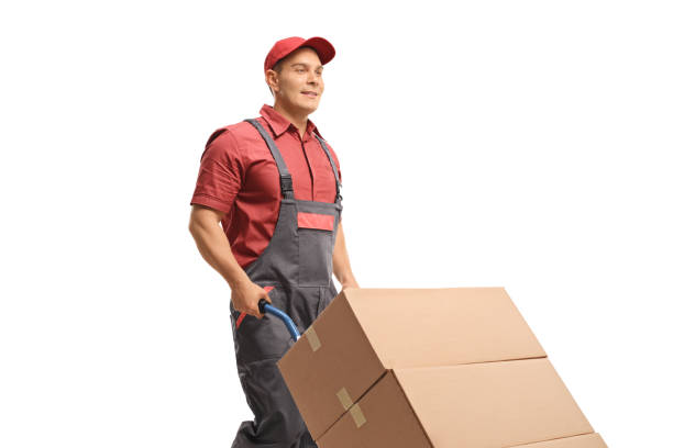 istock Male worker pushing a hand truck with boxes 1158071784