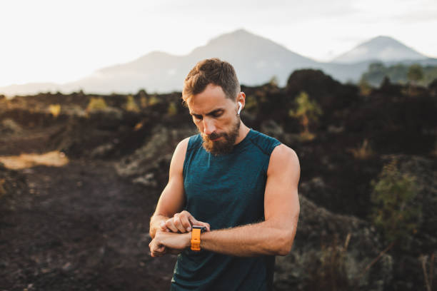 istock Runner checking training results on smart watch. Male athlete using fitness tracker. 1158072966