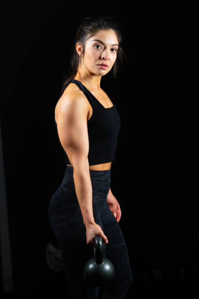 istock Hispanic young fitness female instructor exercising 1158076408