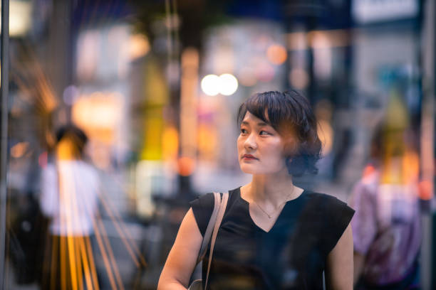 istock Young business woman shopping after work 1158077192