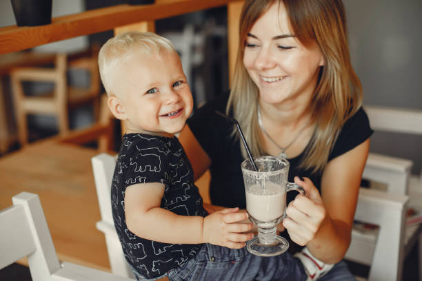 istock Mother with son standing in a cafe 1158078531