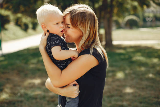 istock Mother with son playing in a summer park 1158079244