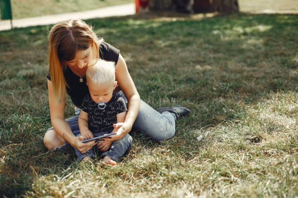 istock Mother with son playing in a summer park 1158079331