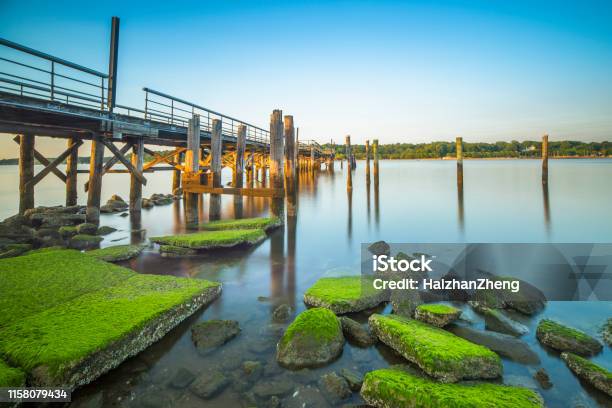 A Fishing Pier During Dusk Stock Photo - Download Image Now - New York State, Long Island, Jones Beach