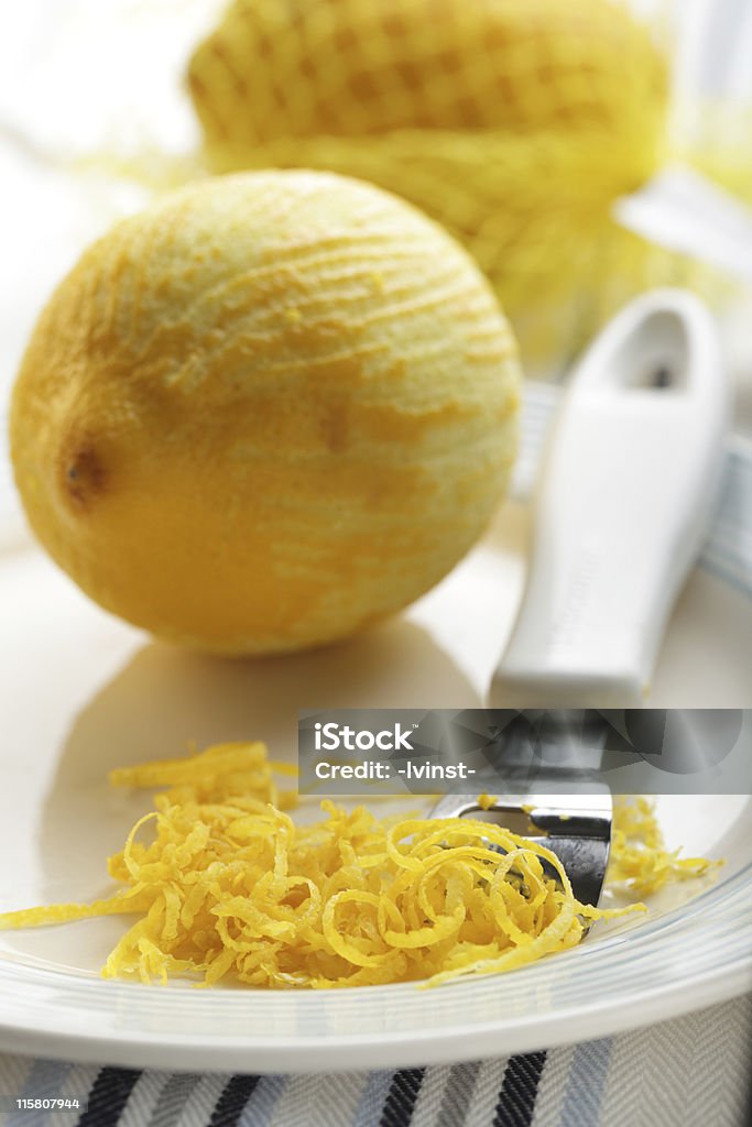 Zest Just scraped lemon zest on the plate Citrus Fruit Stock Photo