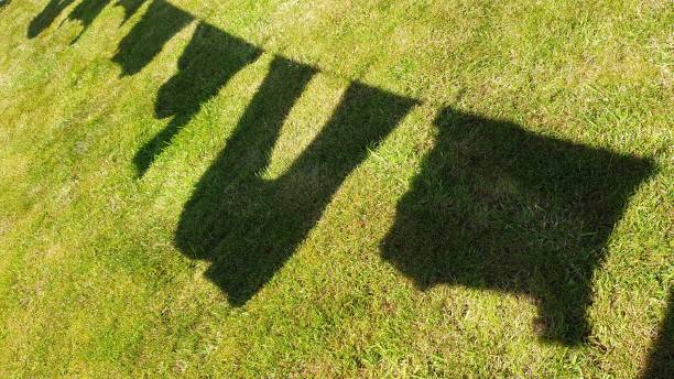istock Silhouette of clothes drying on washing line 1158079530