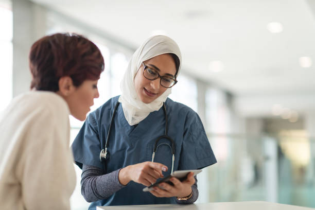 istock Muslim surgeon consults female patient 1158085400