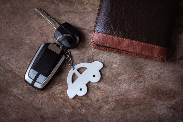 Car keys and wallet on the wooden table. copy space. Car keys and wallet on the wooden table. copy space. car keys table stock pictures, royalty-free photos & images