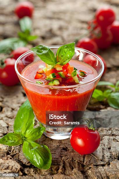 Gazpacho Garnished With Basil And Diced Vegetables On Wood Stock Photo - Download Image Now