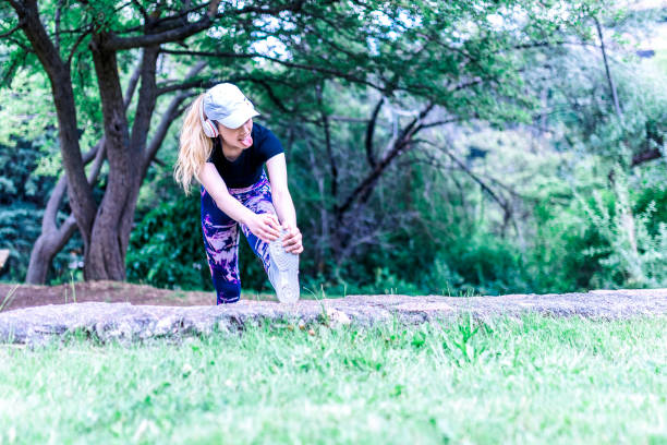 istock Woman stretching her legs as part of training routine 1158086847