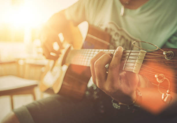 music man asian playing acoustic guitar on stage chord photos stock pictures, royalty-free photos & images