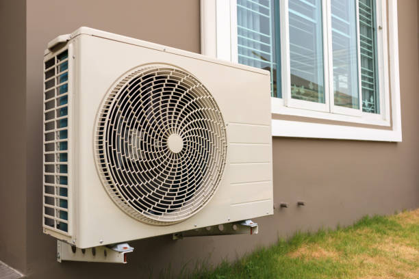 istock Air conditioner compressor outdoor unit installed outside the house 1158090124