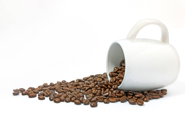 istock Coffee beans in white cup on white background. 1158096380