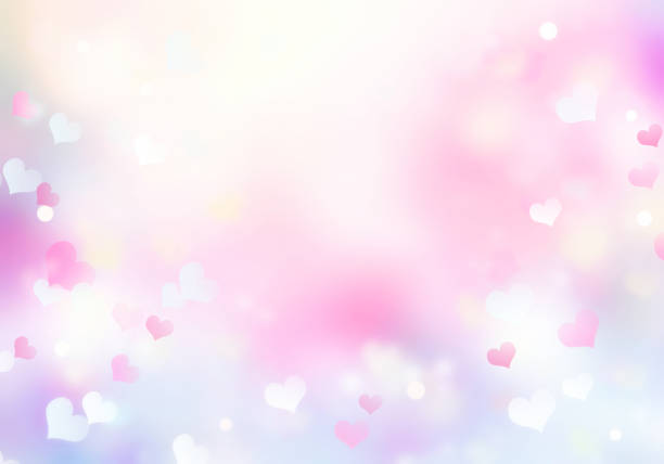 istock Soft colors pink violet blurred bokeh hearts background,valentine texture. 1158098389