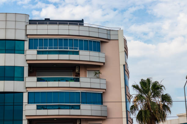 istock a corner shoot from an modern building with balcony - sky landscape as background 1158106942