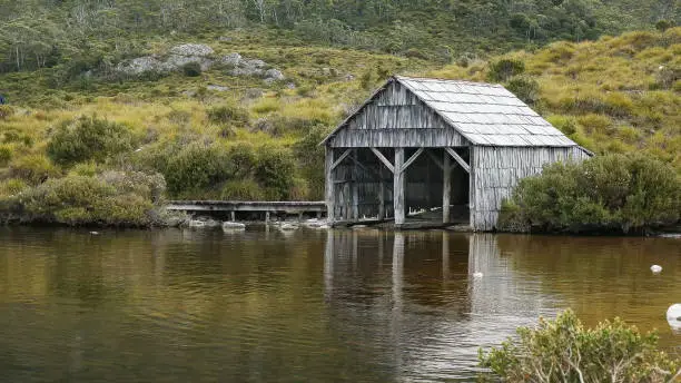 afternoon summer shot of the historic boat shed at dove lake in tasmania, australia