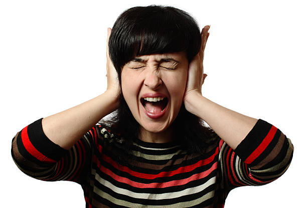 istock Beautiful woman stops her ears and screaming 115811154