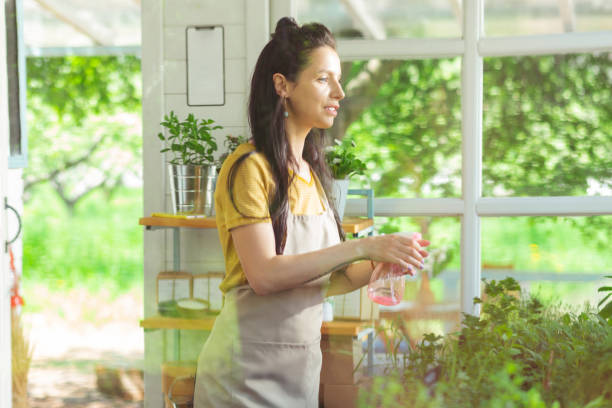 istock Flower shop owner during her working day. 1158116431
