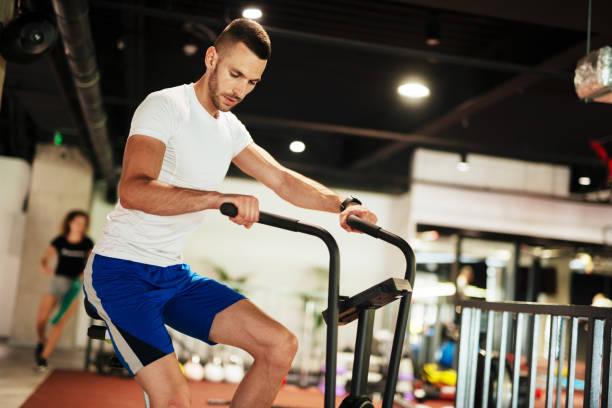 istock Young man in the gym 1158118610