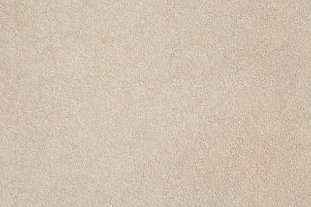 Close-up of beige sandstone with finely pebbled texture