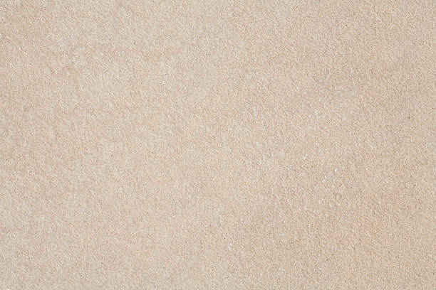 Close-up of beige sandstone with finely pebbled texture Plain sandstone texture ideal for a natural background sandstone stock pictures, royalty-free photos & images