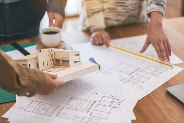 istock an architect working and measuring scale of a mass model 1158122855