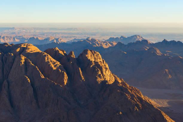 istock Beautiful view from the mountain. Panorama. Mountain range with visible silhouettes through the morning blue fog 1158123940