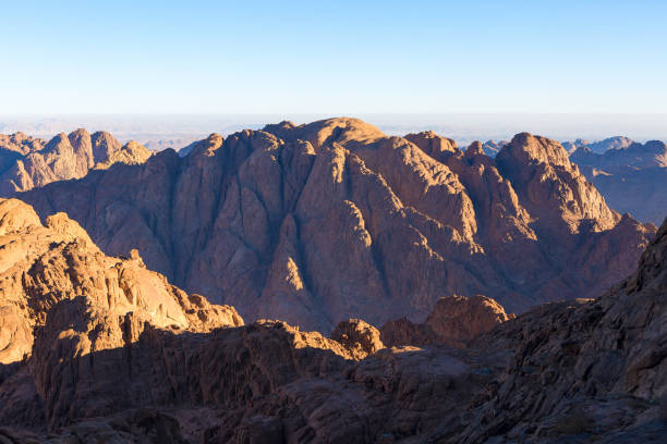 istock Beautiful view from the mountain. Panorama. Mountain range with visible silhouettes through the morning blue fog 1158123965