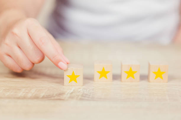 istock customer pressing star on wood cube, Service rating, satisfaction concept. 1158126659