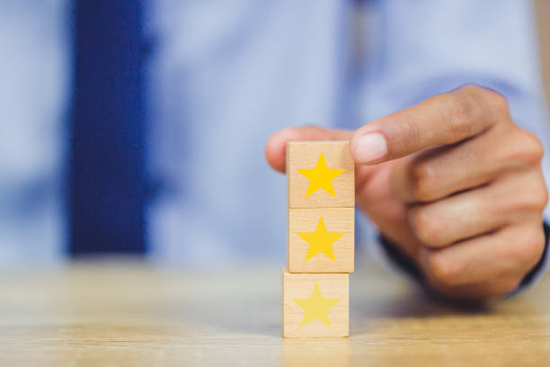 istock customer pressing star on wood cube, Service rating, satisfaction concept. 1158126671