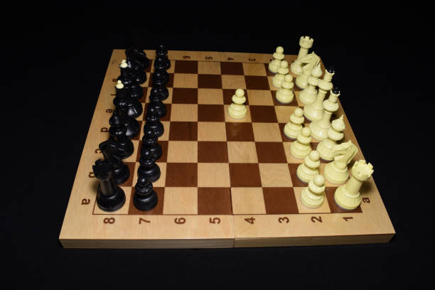 istock Wooden chessboard under black chessmen as a skill theme 1158126865
