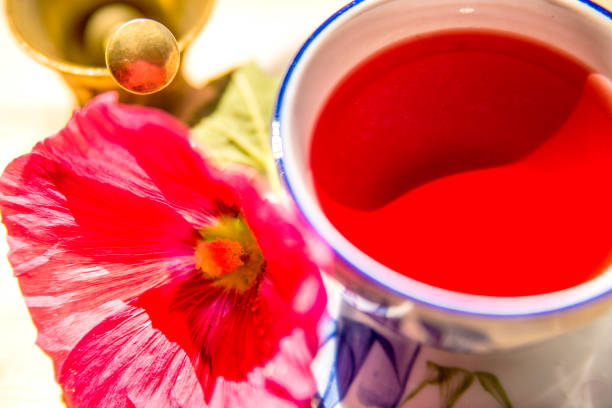 mallow tea, cup with mallow flower and mortar