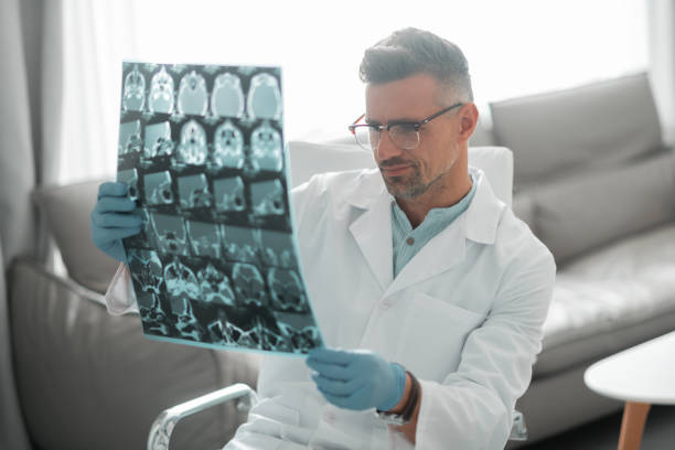 istock Plastic surgeon feeling busy looking at ultrasound investigation 1158130930