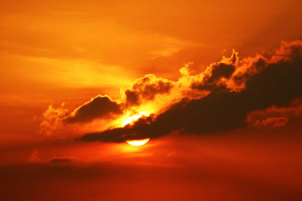 istock sunset on sky and sun ray back silhouette evening cloud 1158133263