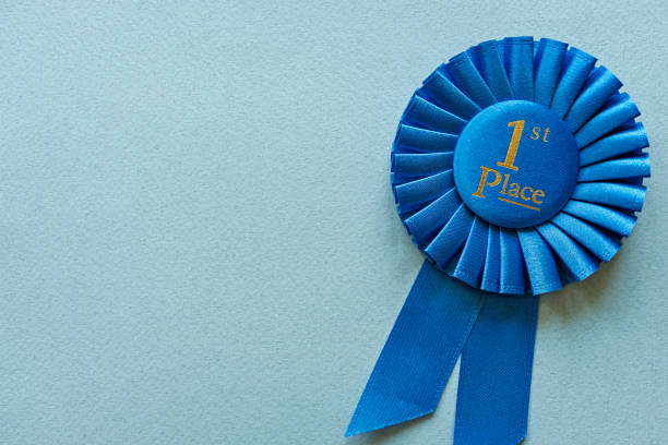 istock Champion or Winners 1st Place blue rosette 1158134757