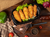 KFC style fried chicken nuggets takeaway in black container.