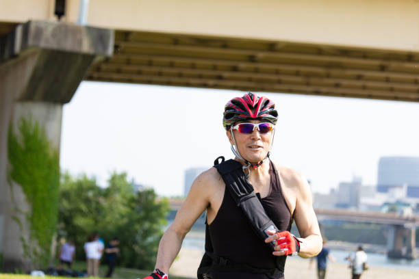 istock Cyclist pushing racing bike 1158136524
