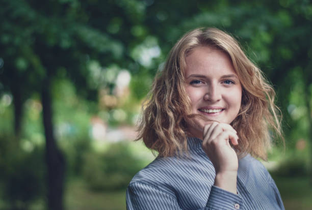 istock Happy attractive blond woman looking back 1158136576