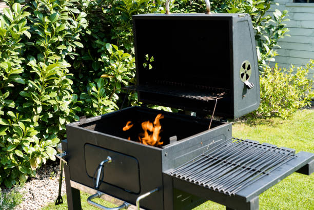 istock Grill with prepared charcoal for grilling outdoors on backyard 1158141894